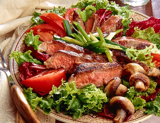 Grilled steak, mushroom and onion salad