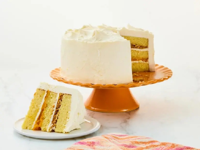 Vanilla cake with mango passion fruit jam and coconut rum buttercream recipe
