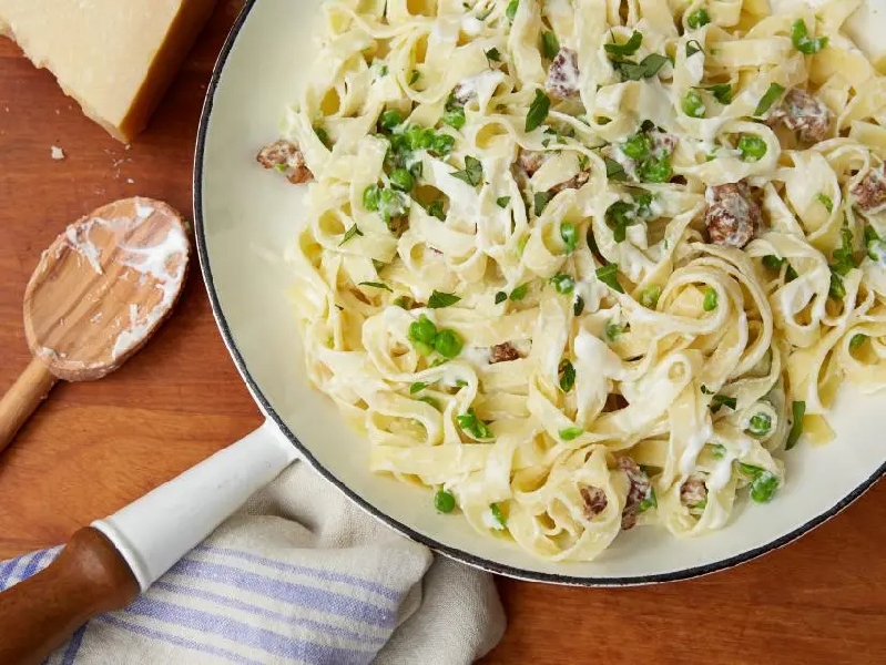 Tagliatelle with smashed peas, sausage, and ricotta cheese recipe