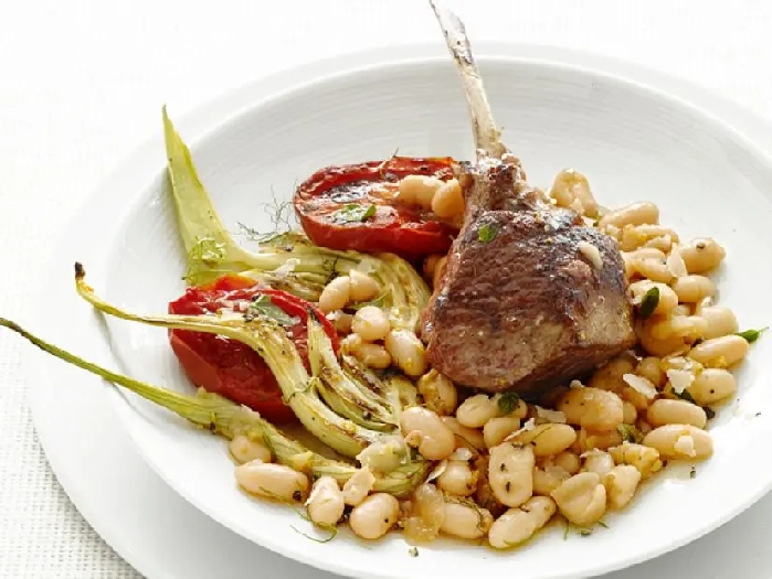 Lamb chops with fennel and tomatoes recipe | food network kitchen | food network