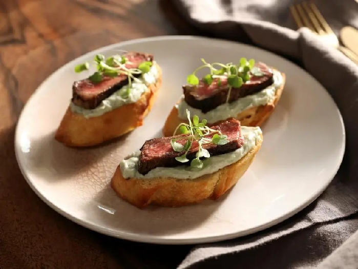 Ny strip crostini with blue cheese spread recipe