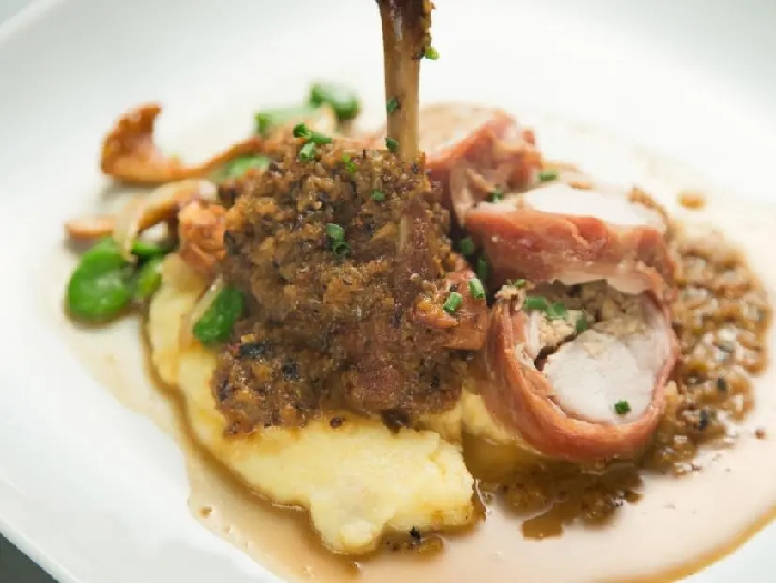 Rabbit with spring vegetable ragu and polenta recipe | anne burrell | food network
