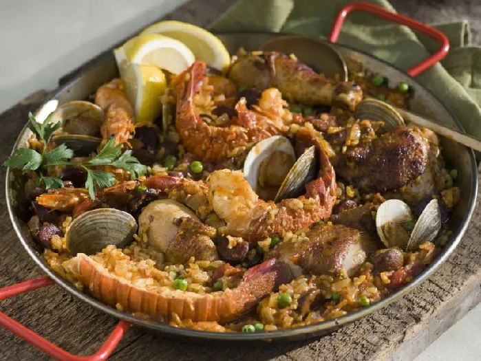 Paella with seafood, chicken, and chorizo recipe