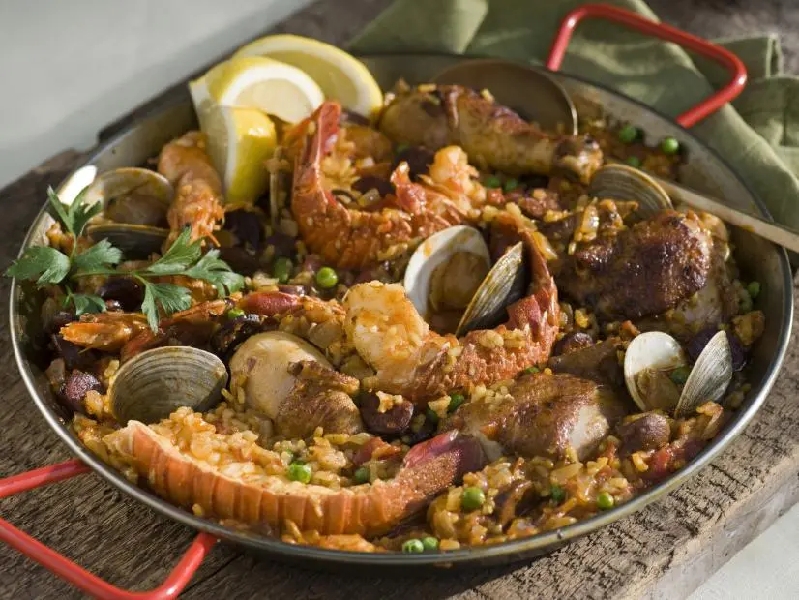 Paella with seafood, chicken, and chorizo recipe