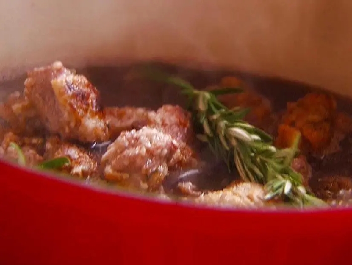 Tagine of lamb stracotto with spring onions recipe | michael chiarello | food network