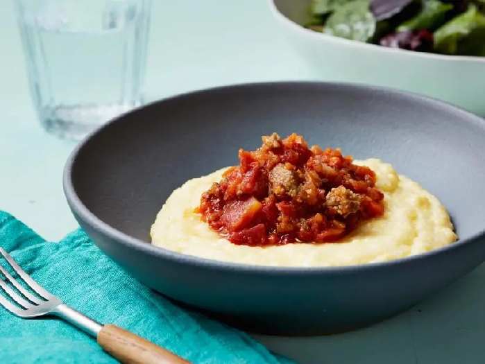 15-minute cheesy polenta with chunky tomato ragu recipe | food network kitchen | food network