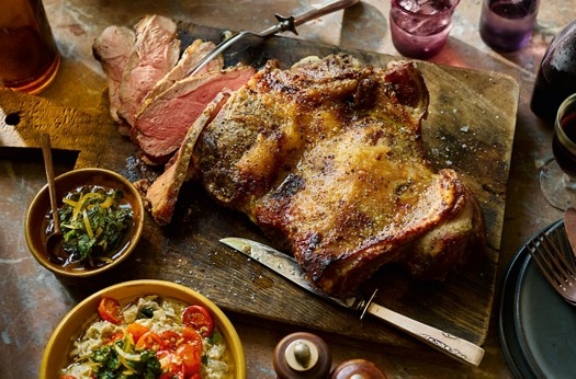 Butterflied leg of lamb with aubergine, roast tomatoes, mint, honey & preserved lemon relish