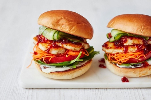 Halloumi burgers with chilli jam, spinach, carrot and cucumber