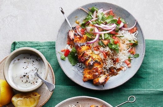 Tikka chicken skewers with tomato salad, rice & yogurt