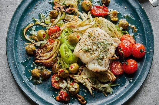 Baked hake with fennel, olives & cherry tomatoes