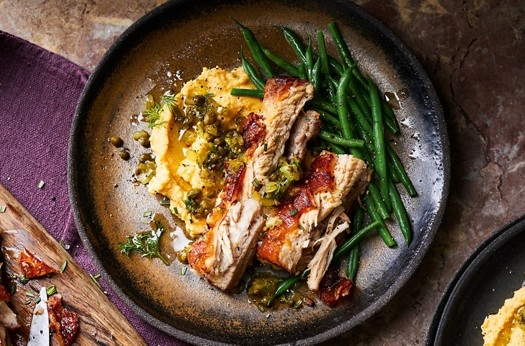 Pork belly with split pea purée, caper & dill pickle dressing