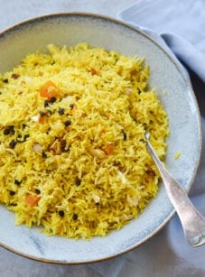 Golden rice pilaf with dried fruit and almonds