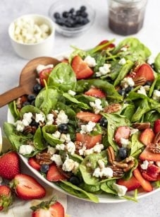 Spinach salad with berries, pecans & raspberry vinaigrette