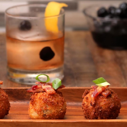 Cheesy bacon mashed potato balls & spiced rum-fashioned