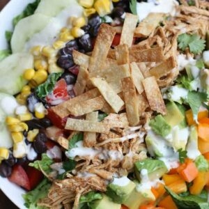 Shredded chicken taco salad with chipotle ranch crema